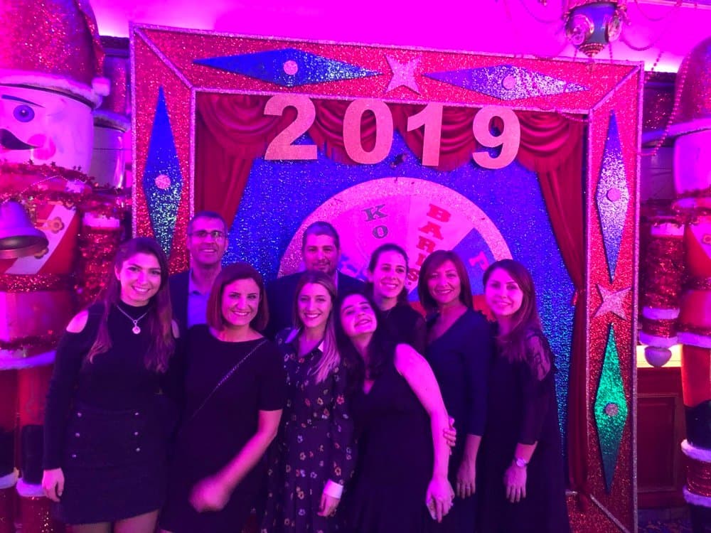 Ecem with colleagues at a New Year celebration