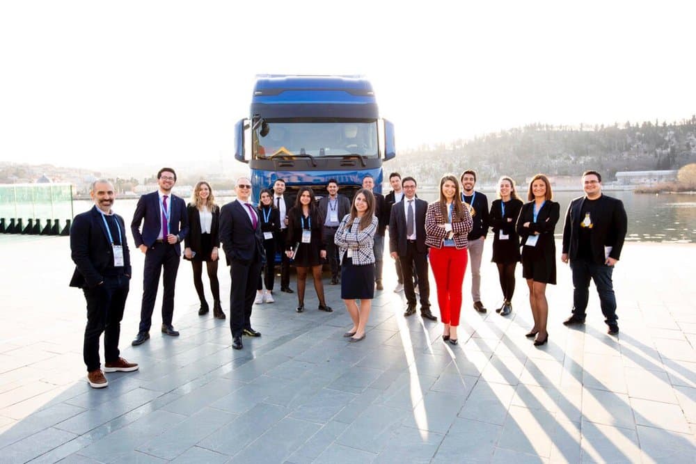 Ecem with colleagues at a Microsoft event by the waterfront